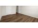 Empty bedroom featuring neutral walls and wood floors at 877 Pensive Run, Dacula, GA 30019