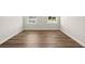 Empty bedroom featuring neutral walls and wood floors at 877 Pensive Run, Dacula, GA 30019
