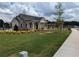 Community building with lush greenery, manicured lawn, and blue skies at 877 Pensive Run, Dacula, GA 30019