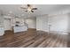 Spacious open concept living room and kitchen with hardwood floors and plenty of natural light at 877 Pensive Run, Dacula, GA 30019
