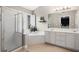 Bright bathroom with separate shower, soaking tub, and white vanity at 1299 Dunwoody Cv, Atlanta, GA 30338