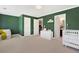 Spacious Bedroom features neutral carpet, green walls, and white trim at 1299 Dunwoody Cv, Atlanta, GA 30338