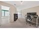 Bright bedroom with built-in bench seating area featuring natural light and open-concept office space at 1299 Dunwoody Cv, Atlanta, GA 30338