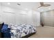 Light bedroom with a floral comforter and dual closets at 1299 Dunwoody Cv, Atlanta, GA 30338