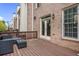 Outdoor wooden deck and patio area with an outdoor seating area at 1299 Dunwoody Cv, Atlanta, GA 30338