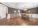 Refined dining area showcases sleek floors, wainscoting details, and elegant table setting at 1299 Dunwoody Cv, Atlanta, GA 30338