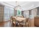 Bright dining area is enhanced by large windows, plantation shutters, and stylish decor at 1299 Dunwoody Cv, Atlanta, GA 30338