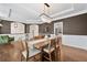 Sophisticated dining room features a tray ceiling, modern lighting, and abundant space at 1299 Dunwoody Cv, Atlanta, GA 30338