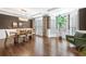 Elegant dining room boasts hardwood floors, natural light and stylish chandelier, ideal for entertaining at 1299 Dunwoody Cv, Atlanta, GA 30338