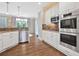 This kitchen offers white cabinets, stainless steel appliances and an open layout at 1299 Dunwoody Cv, Atlanta, GA 30338