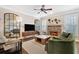 Comfortable living room boasts a stone fireplace, neutral palette, and ample natural light at 1299 Dunwoody Cv, Atlanta, GA 30338