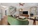 Inviting living room with hardwood floors, plush seating, and staircase at 1299 Dunwoody Cv, Atlanta, GA 30338