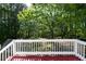 This wooden porch offers a gorgeous view of the surrounding forest at 140 Maplewood Dr, Temple, GA 30179