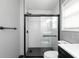 Modern bathroom featuring tile shower and floors at 140 Maplewood Dr, Temple, GA 30179