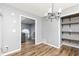 Dining room with hardwood floors, chandelier, and views to other rooms at 140 Maplewood Dr, Temple, GA 30179