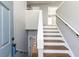 Bright entryway featuring hardwood stairs, neutral walls, and an open floor plan at 140 Maplewood Dr, Temple, GA 30179