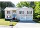 Charming two-story home featuring a two-car garage, stone accents, and a well-maintained front yard at 140 Maplewood Dr, Temple, GA 30179