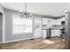 Bright kitchen featuring white cabinetry, stainless steel appliances, and modern finishes at 140 Maplewood Dr, Temple, GA 30179