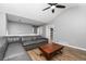 Comfortable living room with hardwood floors, gray walls, and a large sectional sofa at 140 Maplewood Dr, Temple, GA 30179