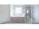Bathroom featuring a glass enclosed shower and separate soaking tub at 1821 Silver Crest Way, Hoschton, GA 30548