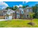 Charming two-story brick home featuring a well-manicured lawn and two-car garage at 1821 Silver Crest Way, Hoschton, GA 30548