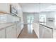 Contemporary kitchen with granite counters, stainless steel appliances, and ample cabinet space at 1821 Silver Crest Way, Hoschton, GA 30548