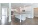 Modern kitchen featuring white cabinetry, granite countertops, and a large center island at 1821 Silver Crest Way, Hoschton, GA 30548
