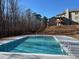 Community swimming pool with deck and fencing at 1821 Silver Crest Way, Hoschton, GA 30548