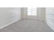 Walk-in closet with shelving, carpeted floors, and natural light at 1821 Silver Crest Way, Hoschton, GA 30548
