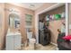 Bathroom features a single vanity, toilet, storage closet, and laundry machines at 365 Falling Timber Ct, Stockbridge, GA 30281