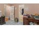 Hallway with view to the bathroom, showcasing a tub and decorative tile accents at 365 Falling Timber Ct, Stockbridge, GA 30281