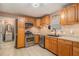 Modern kitchen features stainless steel appliances, granite countertops, and wood cabinets at 365 Falling Timber Ct, Stockbridge, GA 30281