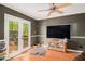 Cozy Living Room features hardwood floors, neutral walls, and french doors leading to the outdoors at 365 Falling Timber Ct, Stockbridge, GA 30281
