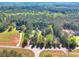 Aerial view of multiple luxury properties, offering expansive land and privacy at 377 Lakeview Dr, Newborn, GA 30056