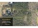 Aerial view of the property showcasing the home and surrounding 6.66 acres of land at 377 Lakeview Dr, Newborn, GA 30056