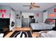 Shared bedroom with sports themed decor, ceiling fan, and two beds at 377 Lakeview Dr, Newborn, GA 30056