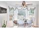 Bright breakfast nook featuring decorative ceiling fan, windows and natural light at 377 Lakeview Dr, Newborn, GA 30056