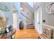 Open foyer area featuring hardwood floors, a staircase, and ample natural light at 377 Lakeview Dr, Newborn, GA 30056