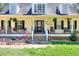 Inviting front porch adorned with rocking chairs and charming decorative accents at 377 Lakeview Dr, Newborn, GA 30056