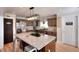 Traditional kitchen with wood cabinets, granite countertops, and stainless-steel appliances at 377 Lakeview Dr, Newborn, GA 30056