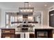 Open kitchen featuring large island with cooktop and open access to the living room at 377 Lakeview Dr, Newborn, GA 30056