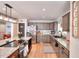 Spacious kitchen with gray cabinets, granite counters, stainless-steel appliances, and central island at 377 Lakeview Dr, Newborn, GA 30056