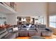 Open concept living room with kitchen and breakfast nook beyond at 377 Lakeview Dr, Newborn, GA 30056