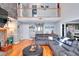 Open living room with stone fireplace, hardwood floors, and second-story overlook at 377 Lakeview Dr, Newborn, GA 30056