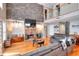 Open living room with stone fireplace, hardwood floors, and second-story overlook at 377 Lakeview Dr, Newborn, GA 30056