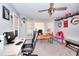 Bright office with bay windows, ceiling fan, and desk with computer at 377 Lakeview Dr, Newborn, GA 30056