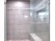 Luxurious shower with custom tiling and a built-in bench, creating a spa-like experience at 377 Lakeview Dr, Newborn, GA 30056
