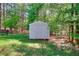 Backyard has a useful storage shed for all your lawn care or recreational needs at 377 Lakeview Dr, Newborn, GA 30056