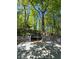 Backyard view from the deck highlighting the trampoline and mature trees at 760 Whitehall Way, Roswell, GA 30076