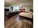 Spacious basement with a fireplace, large sofa, and hardwood style floors at 760 Whitehall Way, Roswell, GA 30076